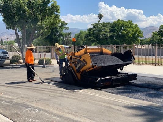 Parking lot in So Cal being pave with asphalt