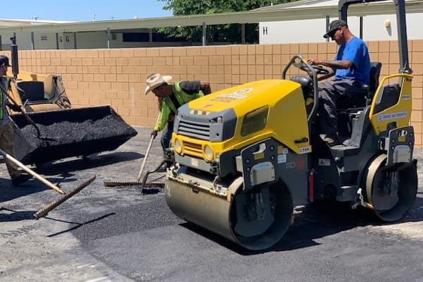 Pothole being repaired in a commercial office space