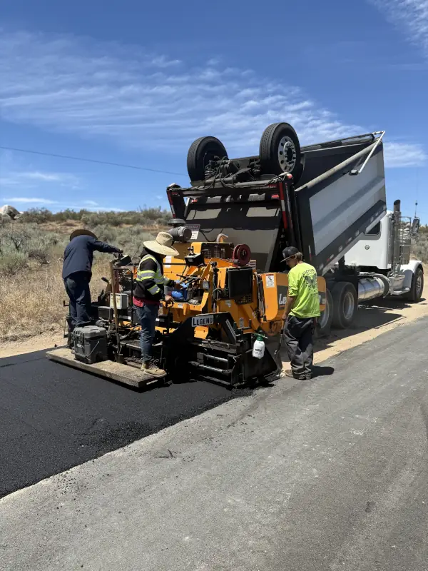 asphalt being installed on on road