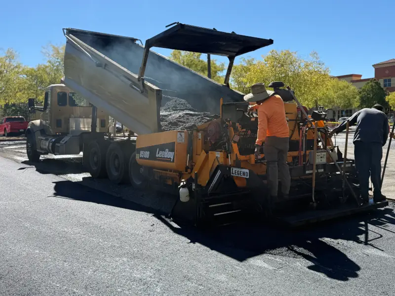 Asphalt paver installing 2" overlay